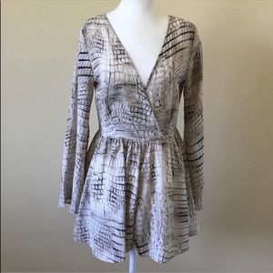 Snake print long sleeve romper.